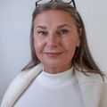 Headshot of a smiling female instructor with a calm demeanor.